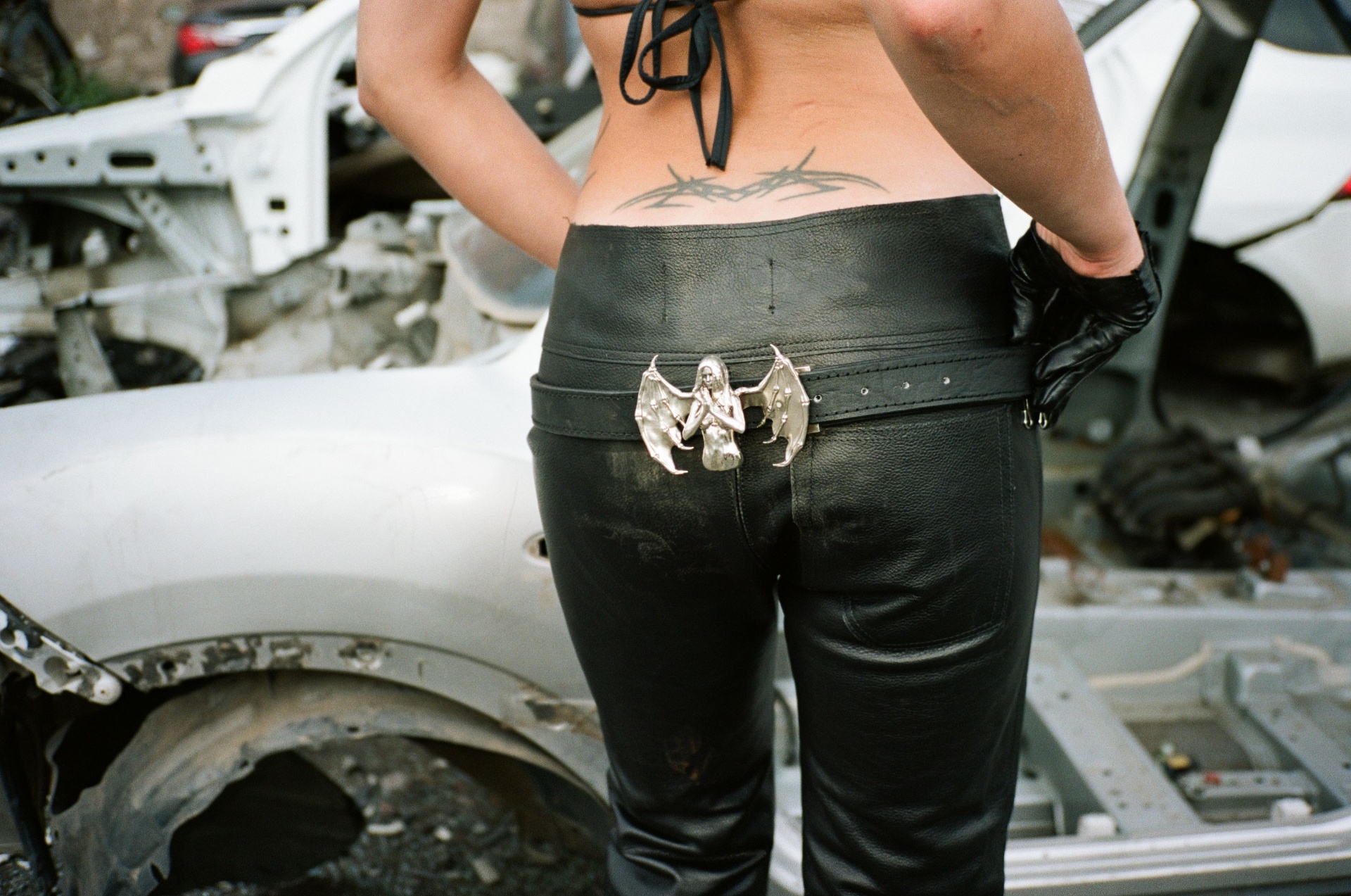 Frame 06 — Belt buckle, close-up